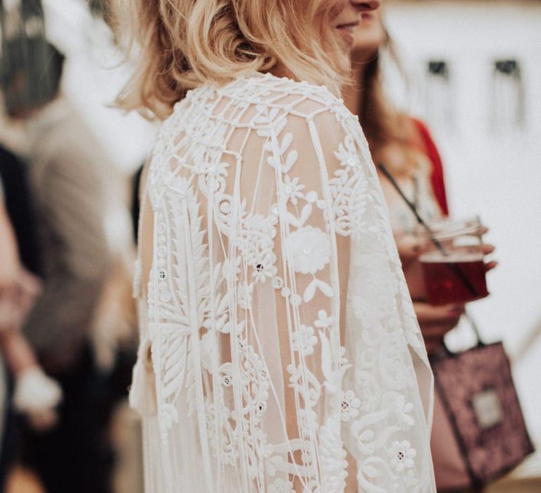 Applique lace detail on oversized sleeve