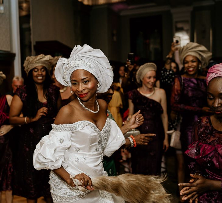 Nigerian bride in traditional dress at money dance