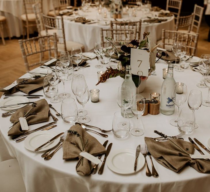 Round wedding reception tables with linen napkins