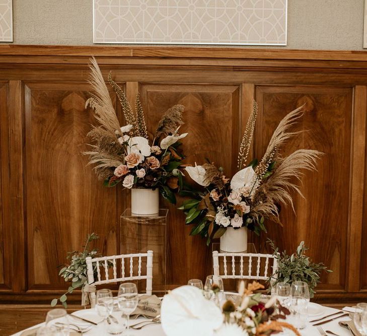 Wedding flower arrangements with pampas grass and white tropical Anthurium flower stems