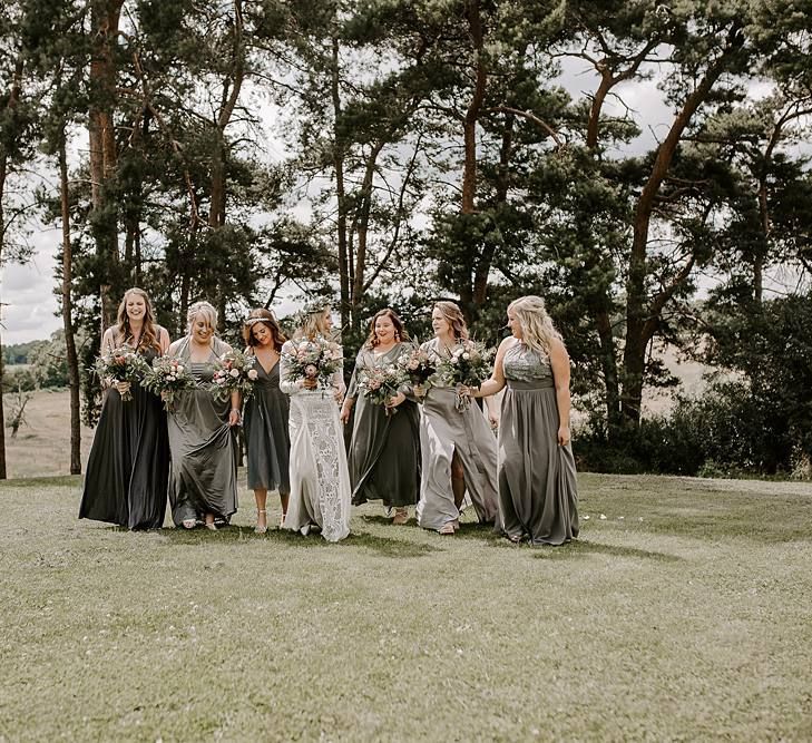 Grey bridesmaid dresses with Protea bouquet