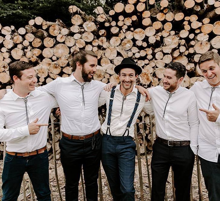 Groom and groomsmen in matching white shirts