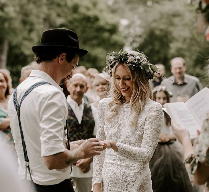 Bride and groom exchange rings