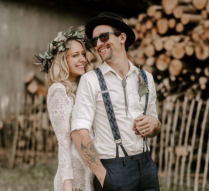 Bride and groom laugh as they pose for photos after the wedding ceremony