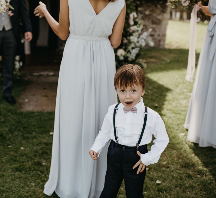 Adorable Page Boy in Braces and Bow Tie