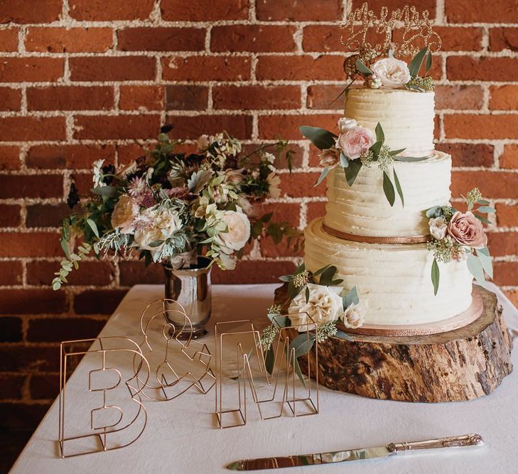 Buttercream Wedding Cake on Log Slice Cake Stand