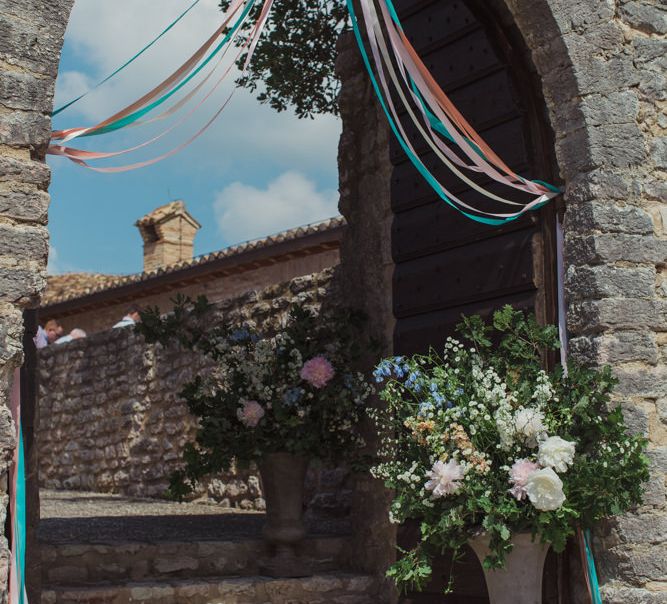 Entrance Decorated in Ribbons and Pastel Floral Arrangement