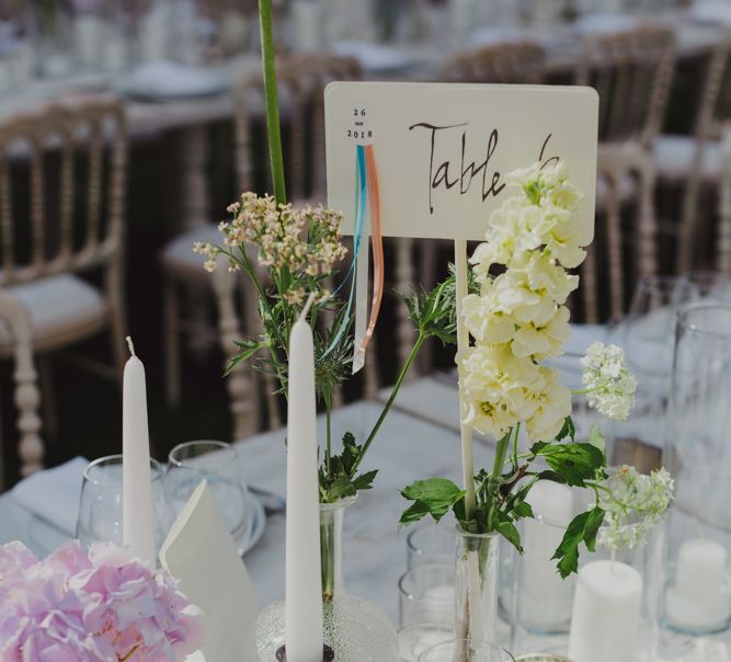 Table Centrepiece Decor Including Candlestick and Flower Stems in Vases