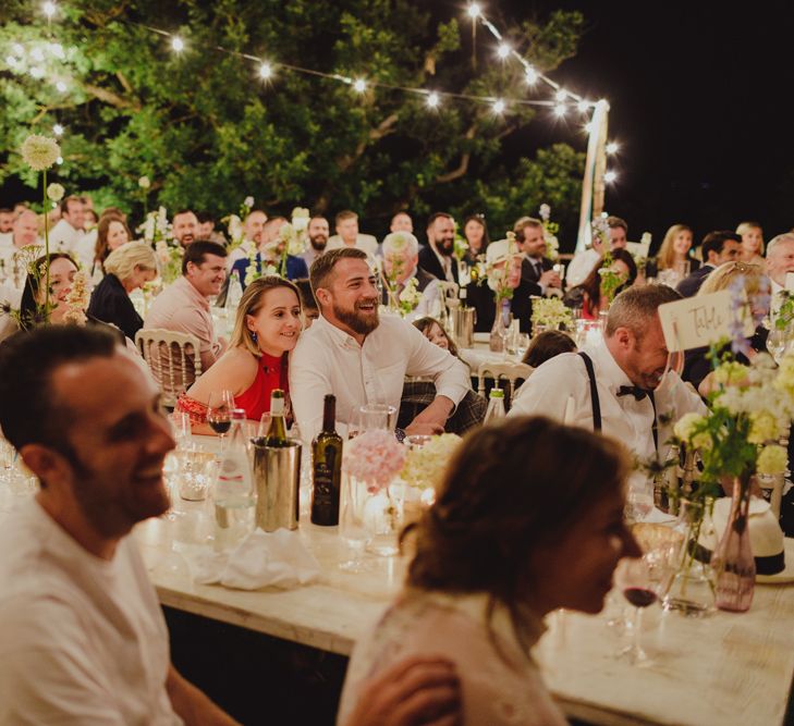 Wedding Guests Laughing During Wedding Reception Speeches