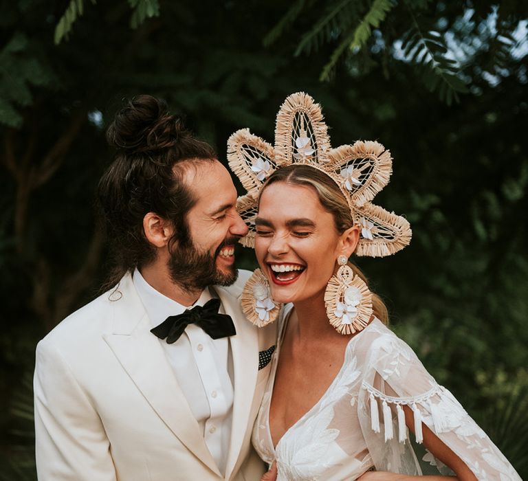 bride wearing a structured bridal crown with natural raffia and fringe detail