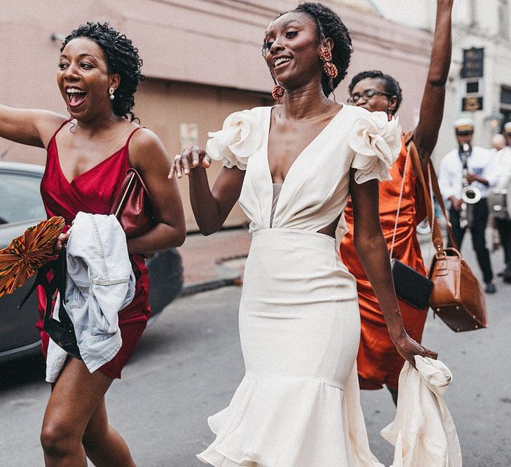 Bride in Johanna Ortiz Wedding Dress Walking Down the Street with Her Bridesmaids