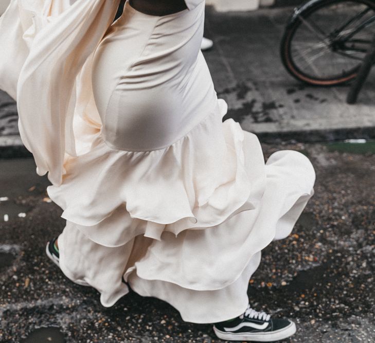 Stylish Bride in Ruffled Skirt Wedding Dress and Vans Wedding Shoes