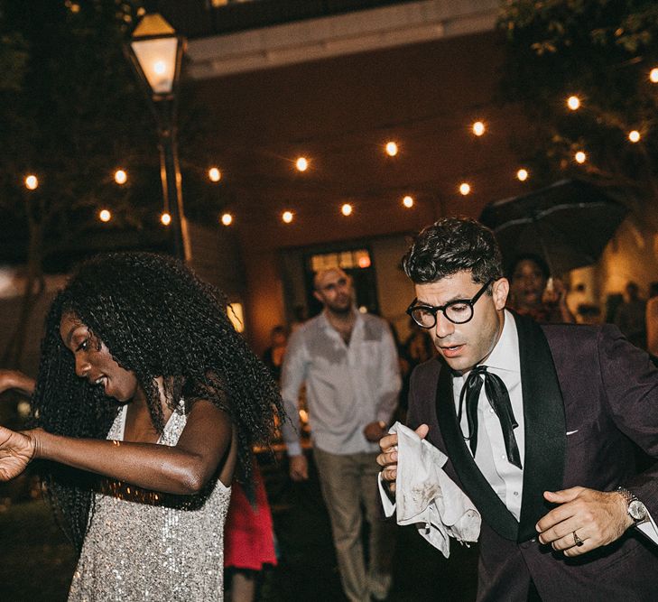 Bride with Curly Hair and Silver Sequin Dress and Groom in Burgundy Suit