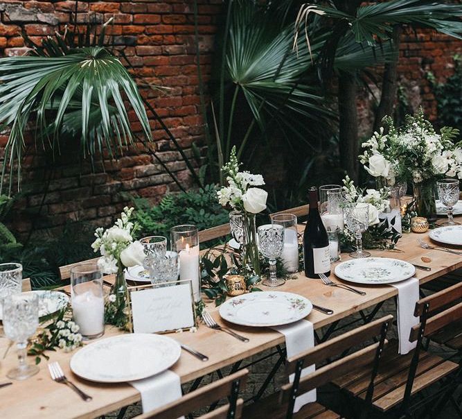 White and Green Wedding Reception Table Decor with Plants, Flowers and Floral Tableware