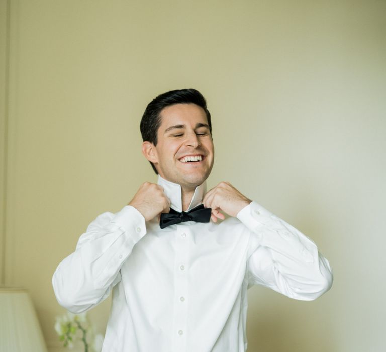 Groom Getting Ready into His Back Tie Suit