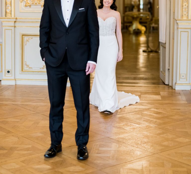 Groom in Black Tuxedo Waiting for His Bride to Approach Him for a First Look