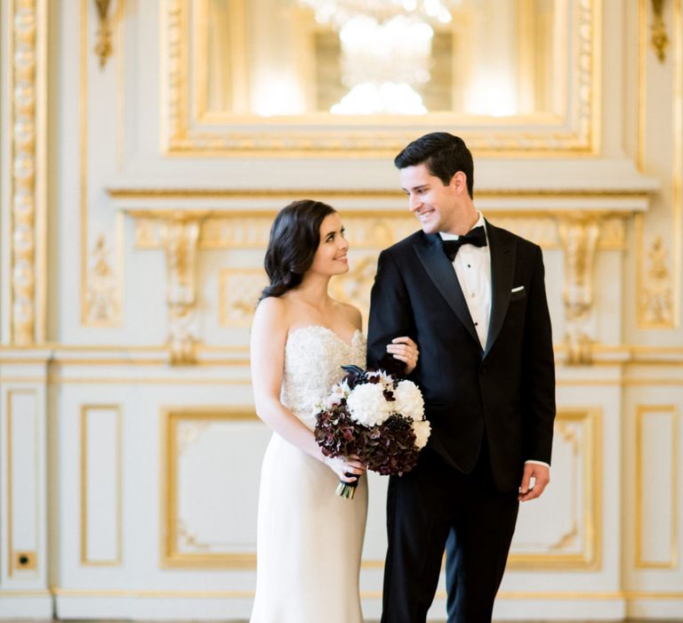 Bride in Sweetheart Neckline Tara Keely Wedding Dress and Groom in Black Tuxedo Arm in Arm