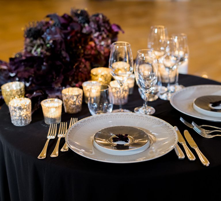 Sweetheart Table with Black Table Cloth, Wedding Flowers and Romantic Candle Light