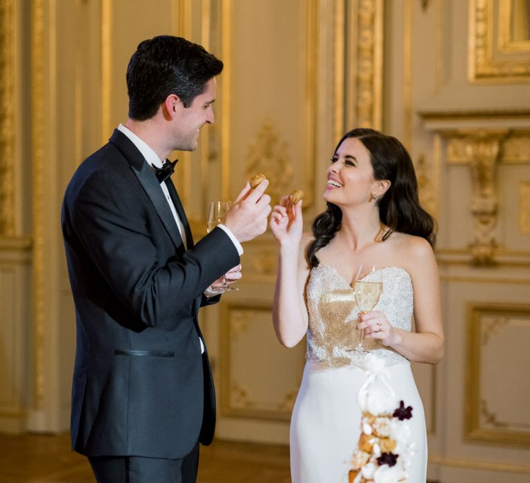 Bride and Groom Eating the Croquembouche Wedding Cake