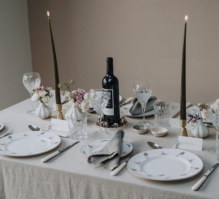 Elegant tablescape styled with patterned tableware and cut glass