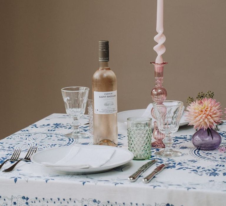 coloured glass candlestick and twisted tapper candle