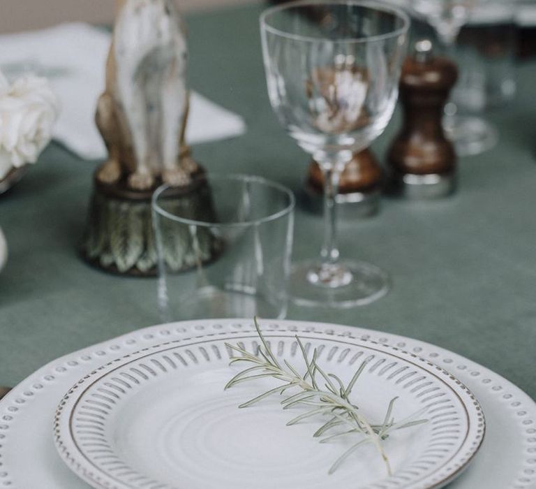 green table linen and printed tableware