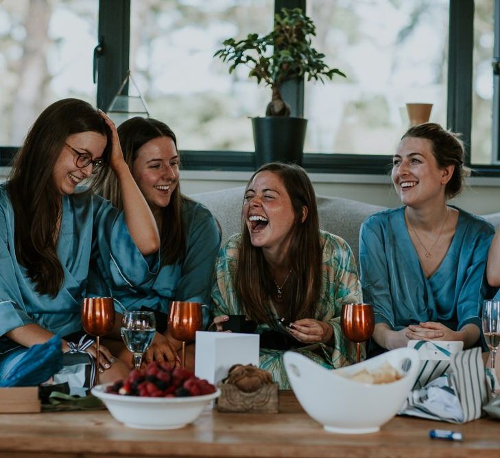 Bridal party in blue getting ready robes