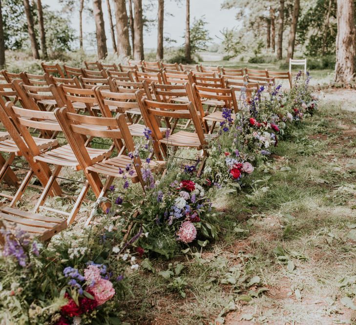 Aisle and altar wedding flowers and decor at Norfolk wedding venue