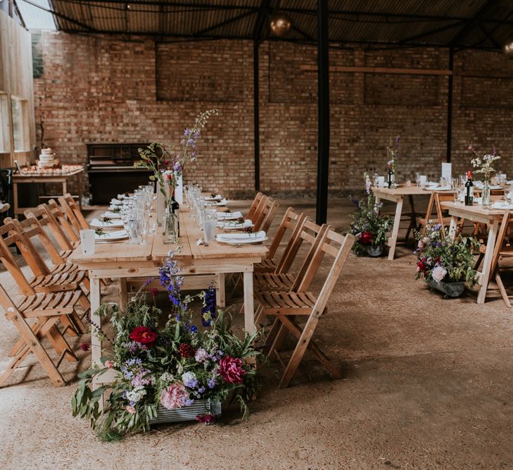 Barn wedding reception with pink flower decor