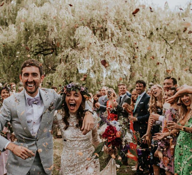 Bride and groom confetti exit