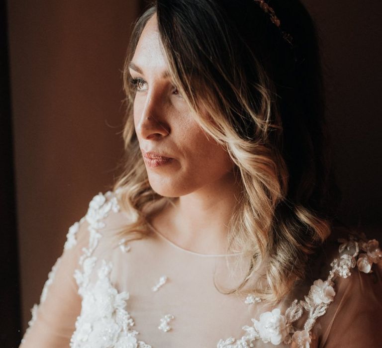 Bridal beauty with appliqué wedding dress and headband