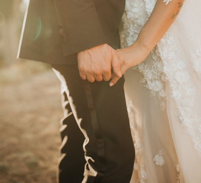 Lace sleeve wedding dress with appliqué detail at destination wedding