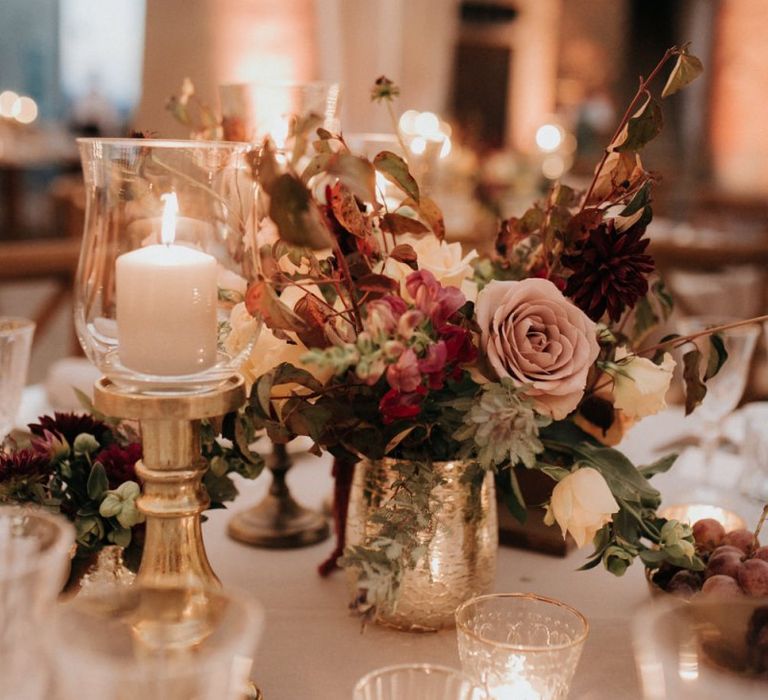 Stunning wedding table decor with blush roses and candles