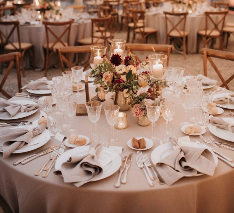 Clear-span marquee decorated by destination wedding planner with candles and roses