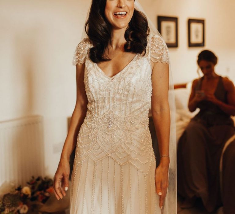 Bride in Maggie Sottero wedding dress during preparations