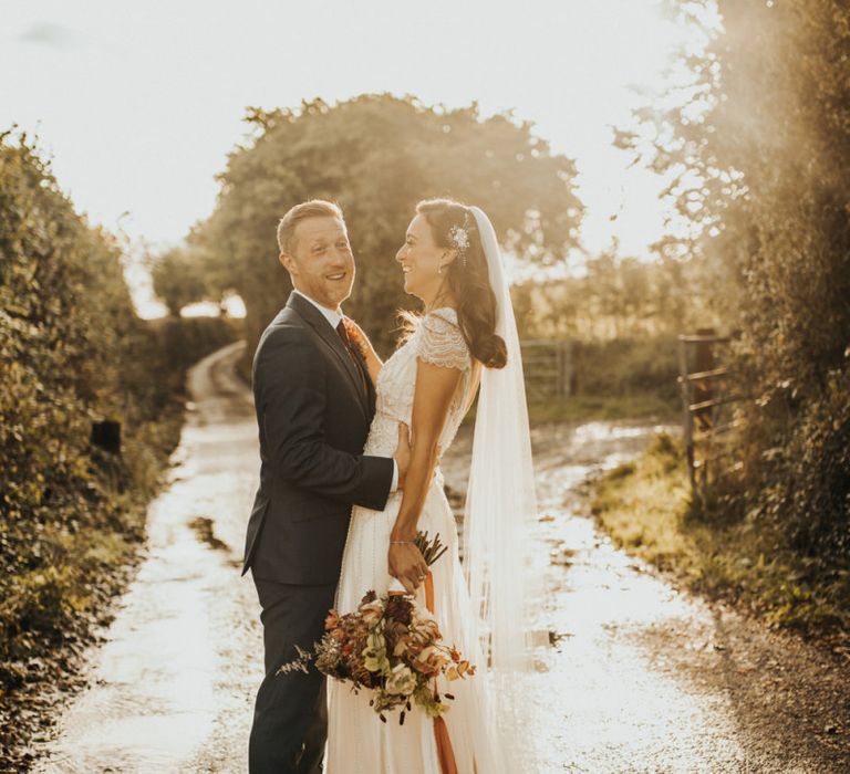 Bride in Maggie Sottero wedding dress and groom at Devon wedding