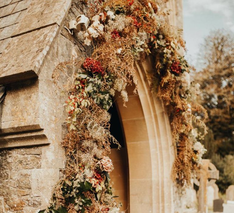 Stunning church entrance flower arch