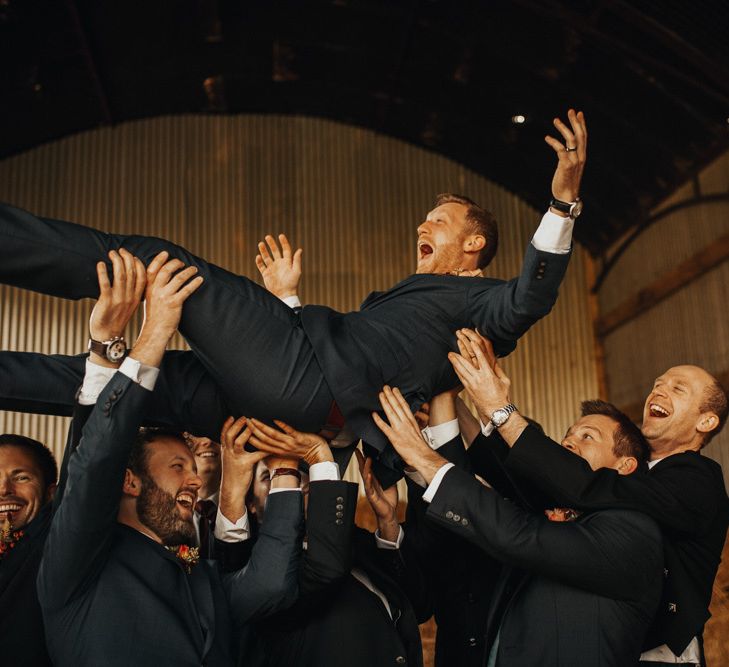 Groom and groomsmen enjoy celenbrations