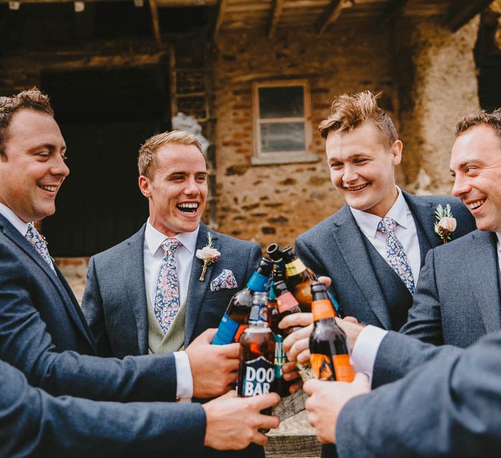 Groomsmen in Blue Suit with Floral Ties