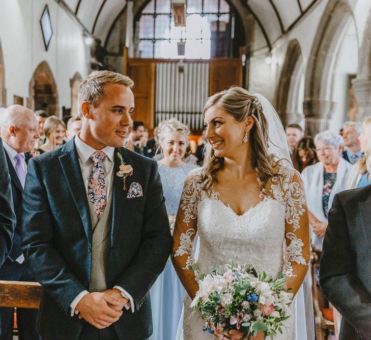 Church Wedding Ceremony with Bride in Lace Sincerity Bridal Wedding Dress and Groom in Blue Ted Baker Suit