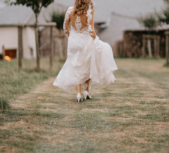 Bride in Lace Sincerity Bridal Wedding Dress with Illusion Back Detail and Long Sleeves