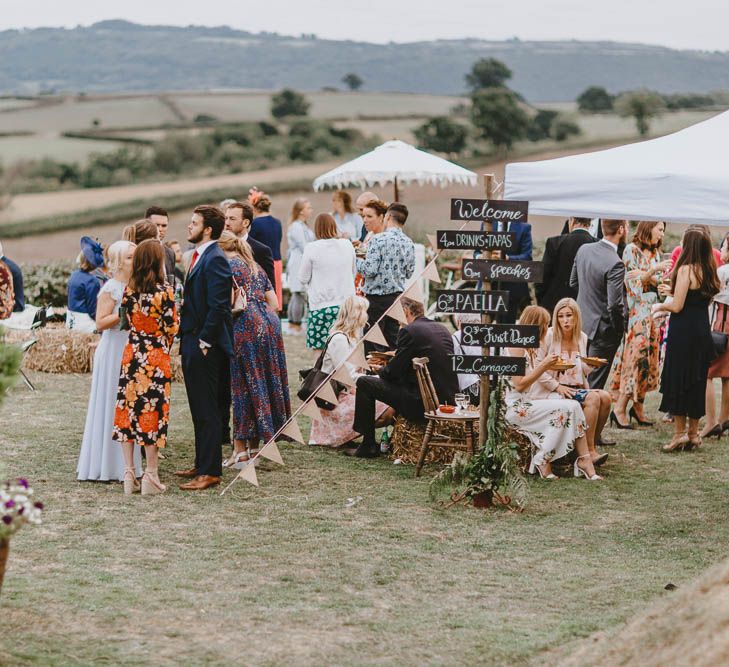 Wedding Guests Enjoying Outdoor Drinks Reception