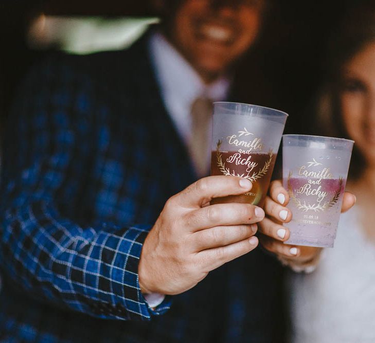 Bride and Groom Toasting with Personalised Wedding Glasses