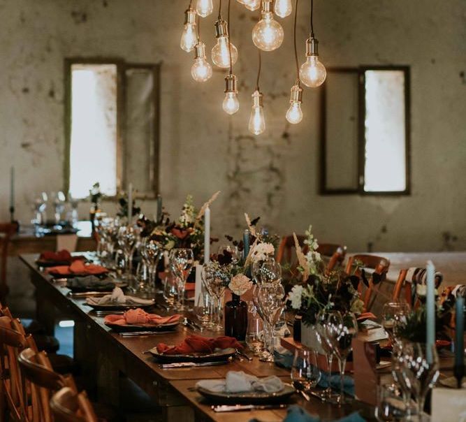 Hanging light installation with perspex table plan