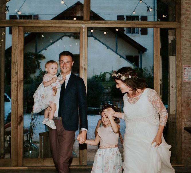 Bride and groom with family