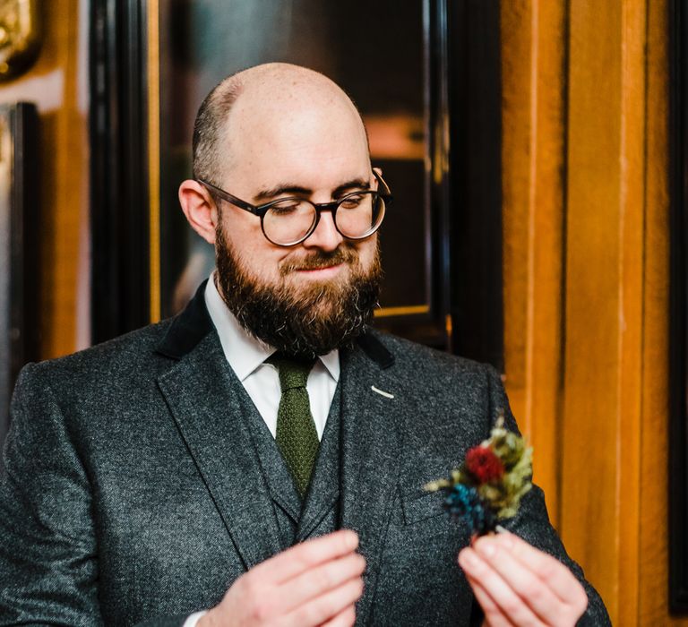 Groom in Chester Barrie Tweed Suit | Candle Lit Christmas Wedding at Gray's Inn London with Christmas Carols &amp; Festive Wreaths | John Barwood Photography