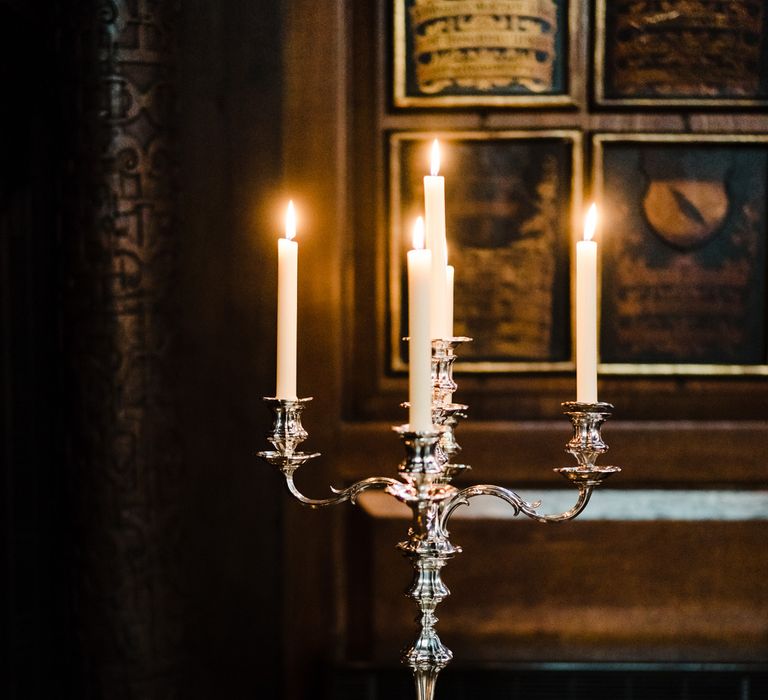 Silver Candelabra | Candle Lit Christmas Wedding at Gray's Inn London with Christmas Carols &amp; Festive Wreaths | John Barwood Photography