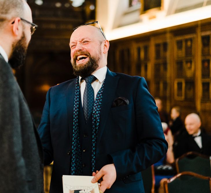 Groom in Chester Barrie Tweed Suit | Candle Lit Christmas Wedding at Gray's Inn London with Christmas Carols &amp; Festive Wreaths | John Barwood Photography