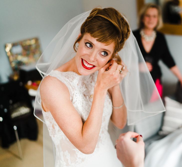 Wedding Morning Bridal Preparations | Bride in Lace San Patrick Bridal Gown | Red Lipstick | Candle Lit Christmas Wedding at Gray's Inn London with Christmas Carols &amp; Festive Wreaths | John Barwood Photography