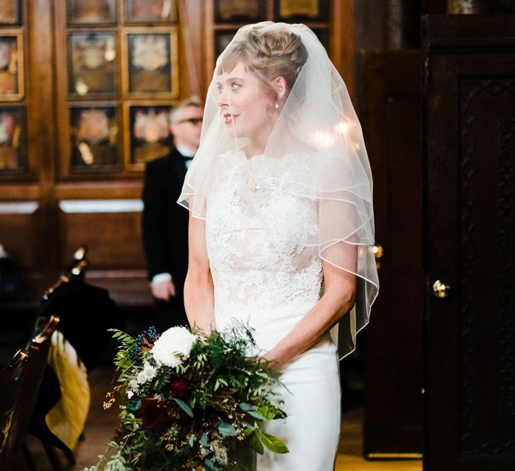 Wedding Ceremony Bridal Entrance in Lace San Patrick Gown &amp; Veil | Candle Lit Christmas Wedding at Gray's Inn London with Christmas Carols &amp; Festive Wreaths | John Barwood Photography